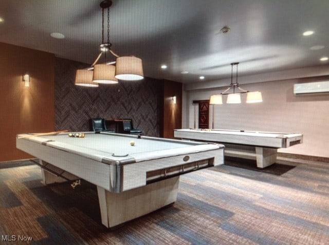 recreation room with pool table, a wall mounted AC, and dark colored carpet