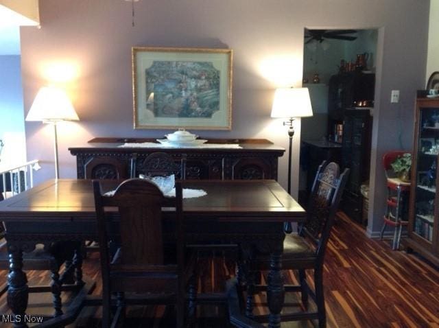 dining room featuring wood-type flooring and ceiling fan