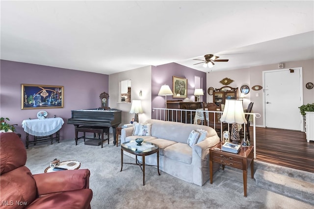 living room with hardwood / wood-style flooring and ceiling fan