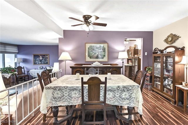 dining room with dark wood-type flooring and ceiling fan