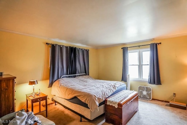 carpeted bedroom featuring crown molding