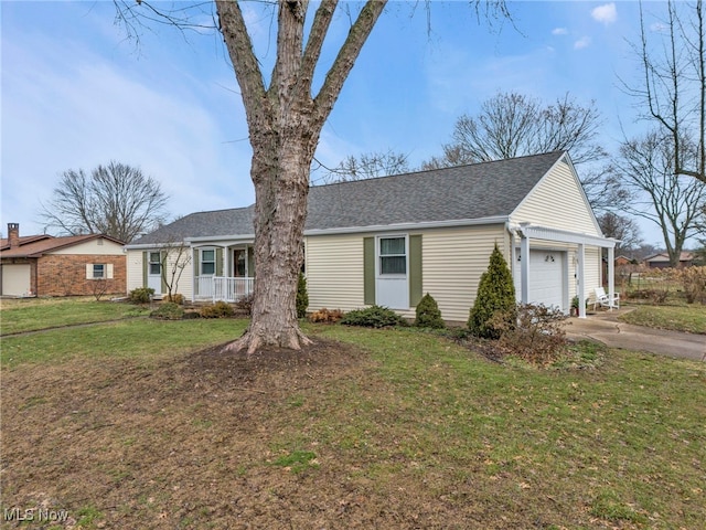 single story home with a garage, a front lawn, and covered porch