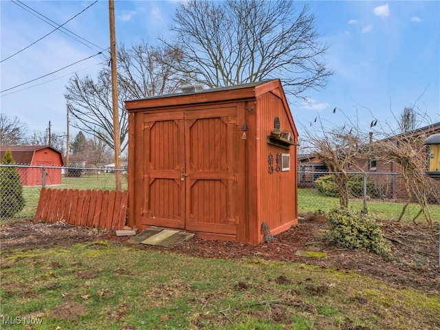 view of outdoor structure with a lawn