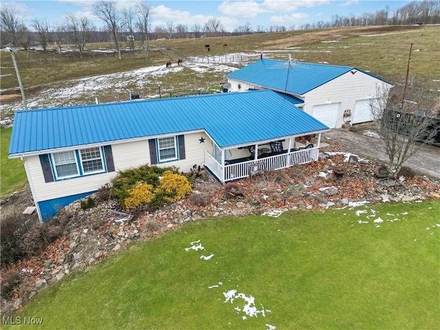 birds eye view of property with a rural view