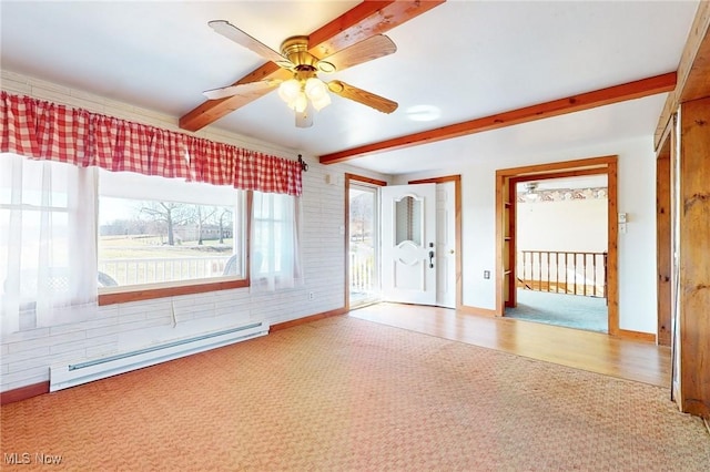 empty room featuring ceiling fan, light colored carpet, beam ceiling, and a baseboard heating unit