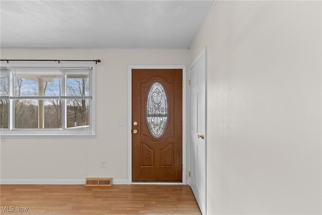 foyer with light hardwood / wood-style flooring