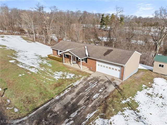 view of front of property with a garage and covered porch