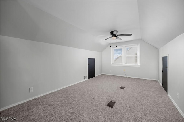 bonus room featuring ceiling fan, carpet flooring, and vaulted ceiling