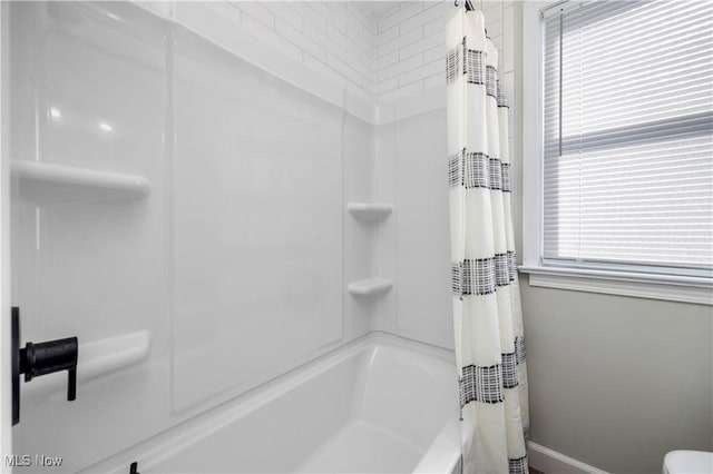 bathroom featuring shower / bath combination with curtain