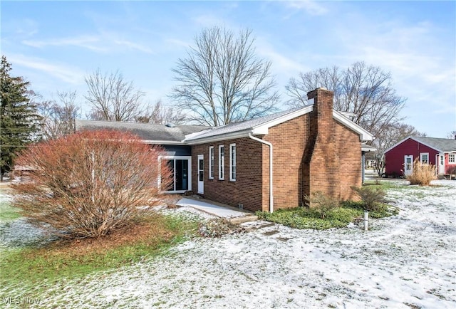 view of snow covered property