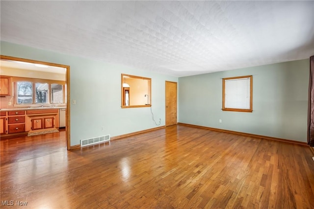 spare room featuring hardwood / wood-style flooring