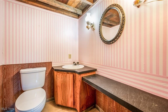 bathroom with tile patterned floors, vanity, and toilet