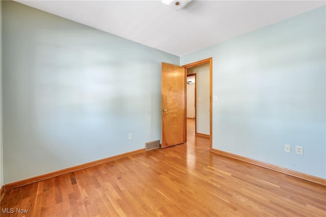 unfurnished room featuring light hardwood / wood-style floors