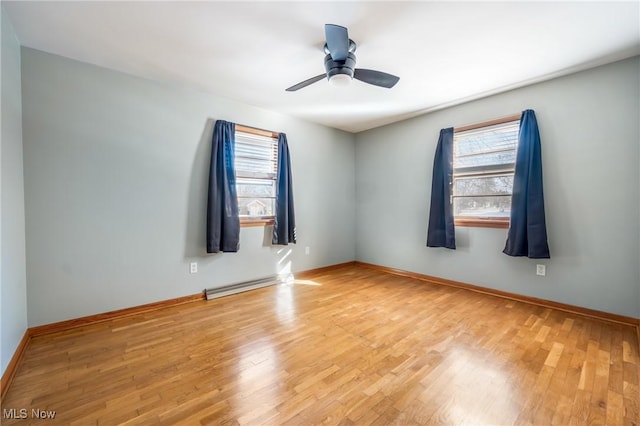 unfurnished room featuring light hardwood / wood-style flooring, plenty of natural light, and ceiling fan