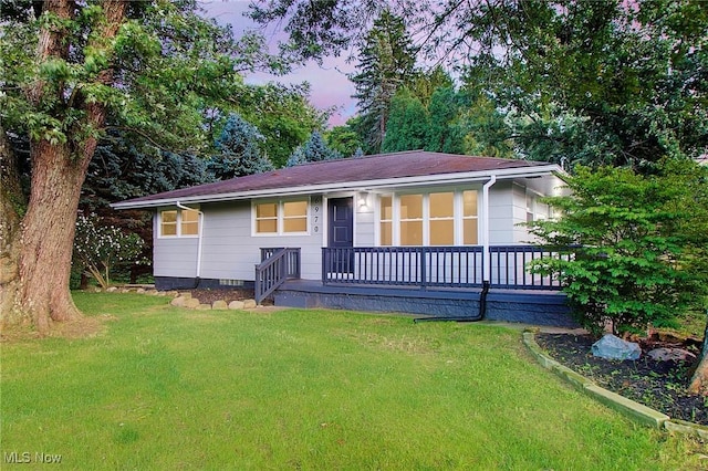 view of front of property with a lawn