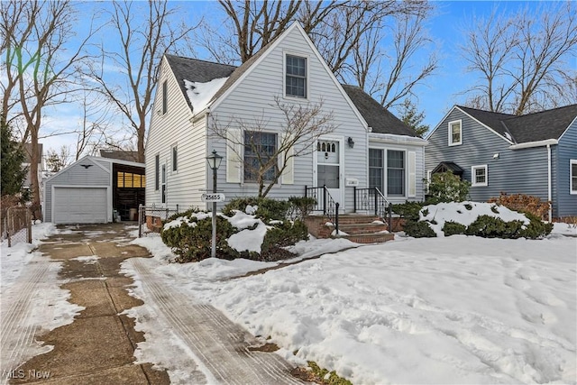 view of front of home with a garage and an outdoor structure