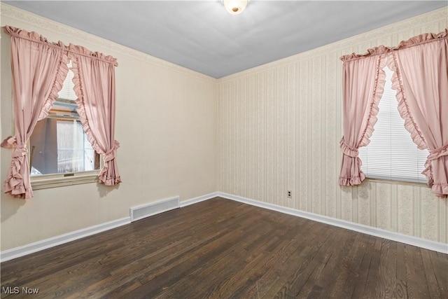 spare room with dark hardwood / wood-style flooring