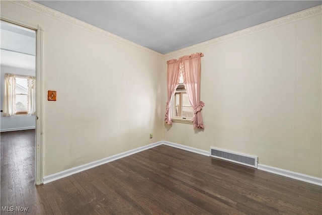 unfurnished room with dark wood-type flooring