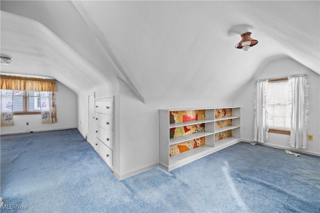 bonus room featuring a wealth of natural light, vaulted ceiling, and carpet