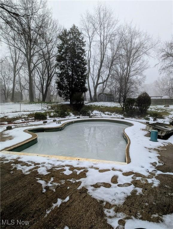 view of snow covered pool