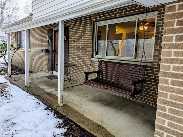 view of snow covered patio