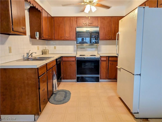 kitchen featuring sink, dishwasher, backsplash, electric range, and white fridge