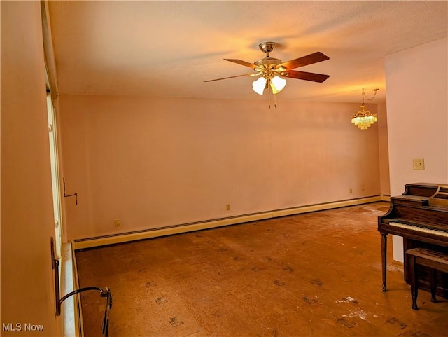 misc room featuring a baseboard radiator and ceiling fan with notable chandelier