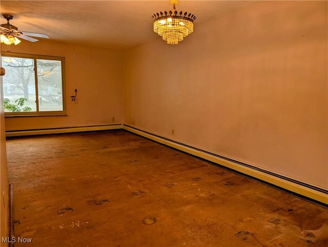 unfurnished room featuring ceiling fan with notable chandelier and wood-type flooring