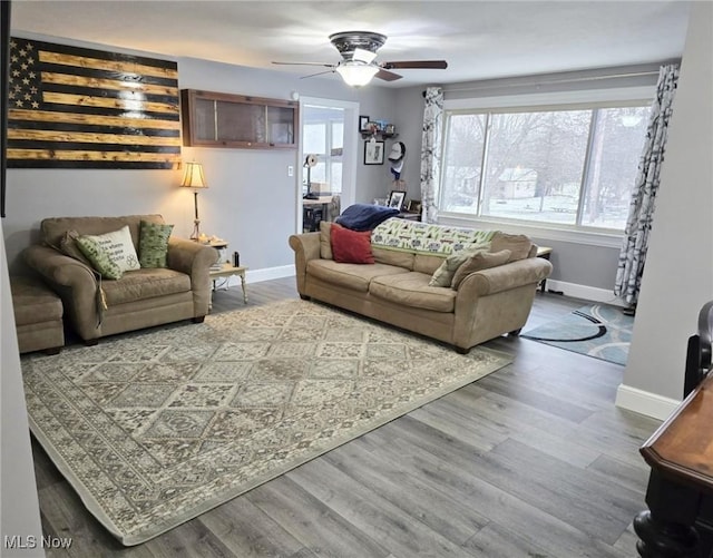 living room featuring hardwood / wood-style flooring and ceiling fan