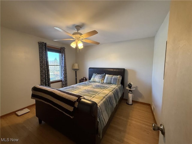 bedroom featuring ceiling fan and hardwood / wood-style floors