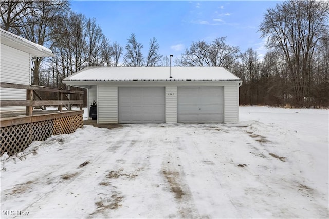 view of snow covered garage