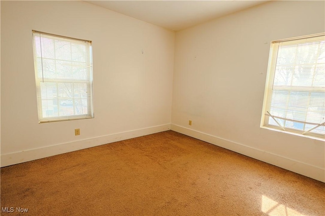 unfurnished room with carpet flooring