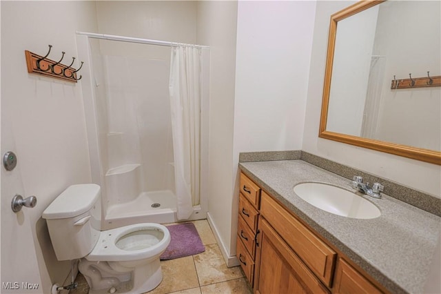 bathroom with toilet, vanity, tile patterned floors, and walk in shower