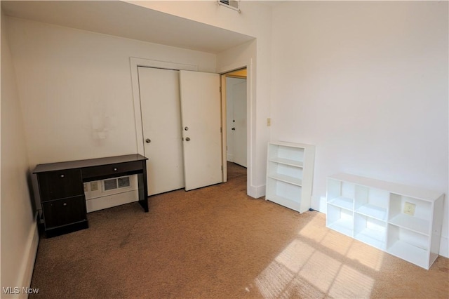 interior space with light colored carpet and a closet