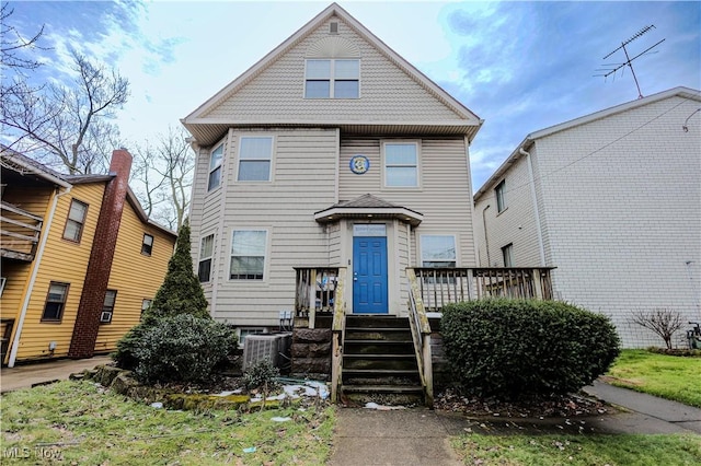 view of front of home featuring central air condition unit