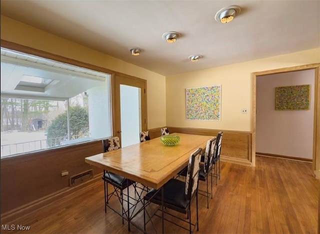 dining area with wood-type flooring