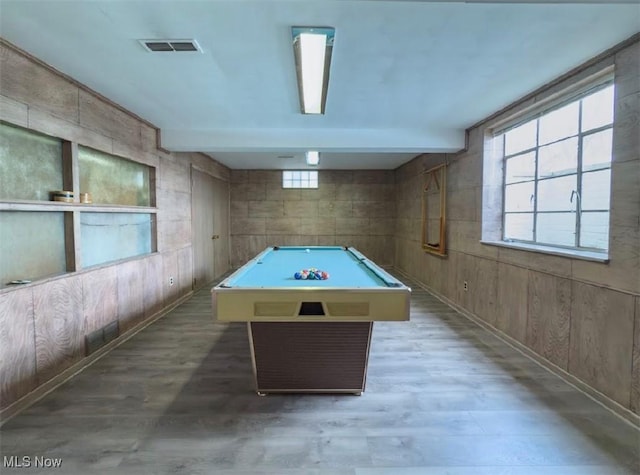 recreation room with billiards, wooden walls, and hardwood / wood-style floors