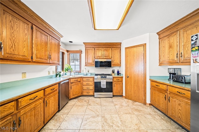 kitchen featuring light tile patterned flooring and stainless steel appliances