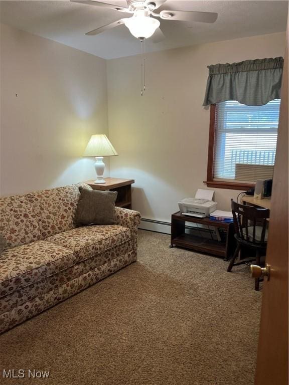 living room with a baseboard heating unit, carpet floors, and ceiling fan