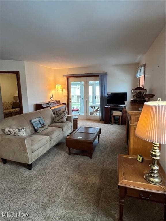 living room with french doors and carpet