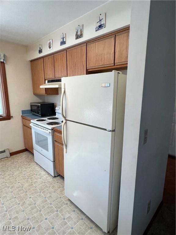 kitchen with a baseboard radiator and white appliances