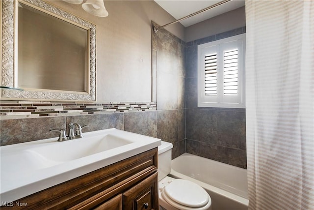 full bathroom featuring vanity, shower / washtub combination, and toilet