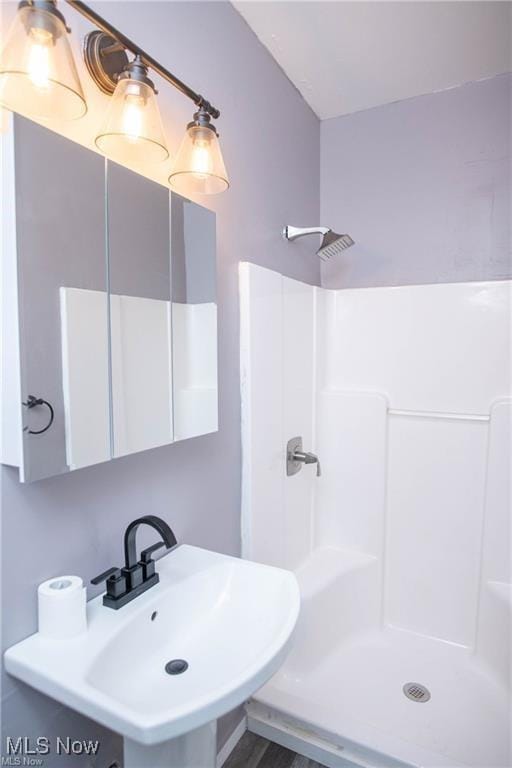 bathroom featuring sink and walk in shower