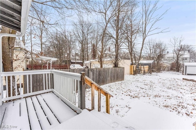 view of snow covered deck