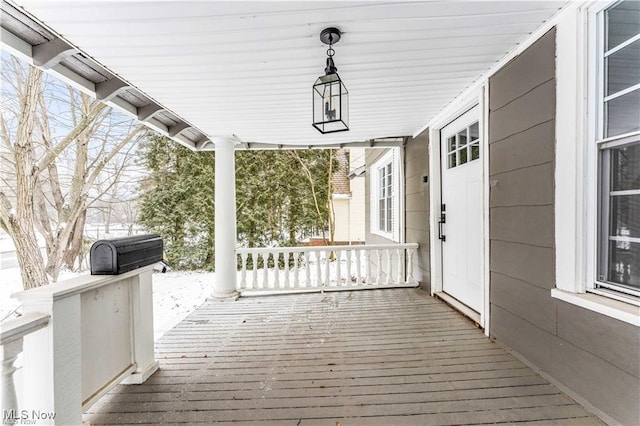 wooden terrace featuring grilling area