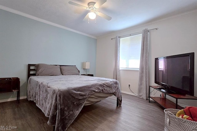 bedroom with crown molding, ceiling fan, and dark hardwood / wood-style floors