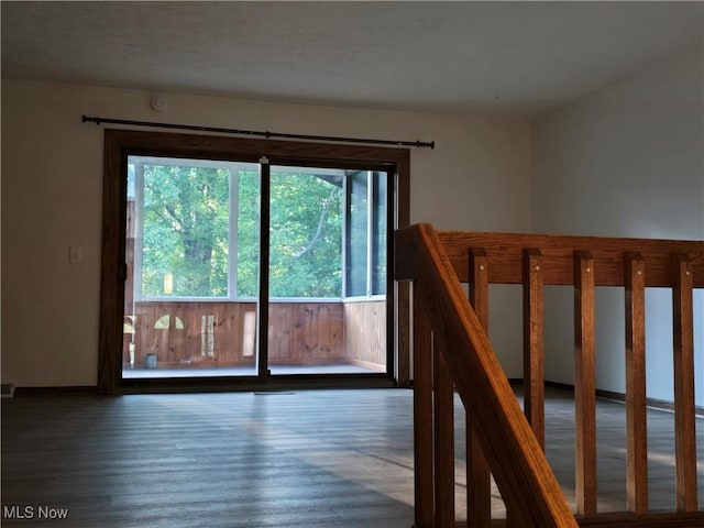 stairway with hardwood / wood-style flooring