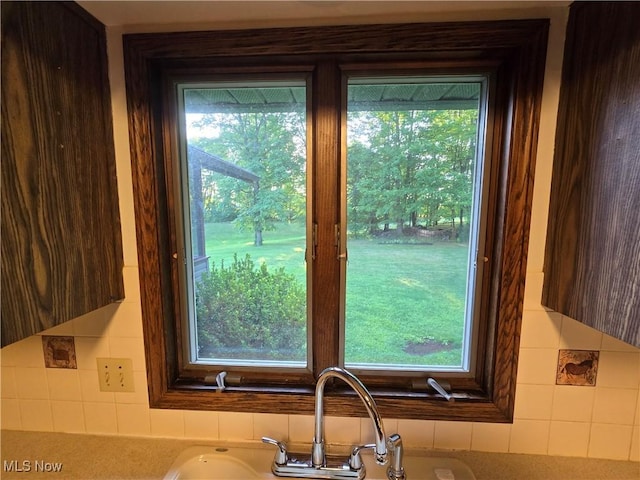 interior details with dark brown cabinetry and sink