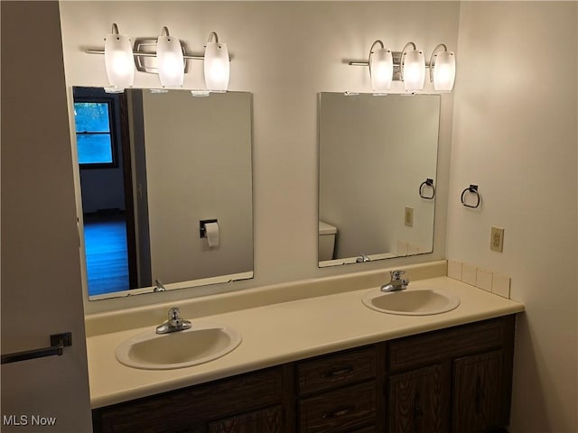 bathroom with vanity and toilet