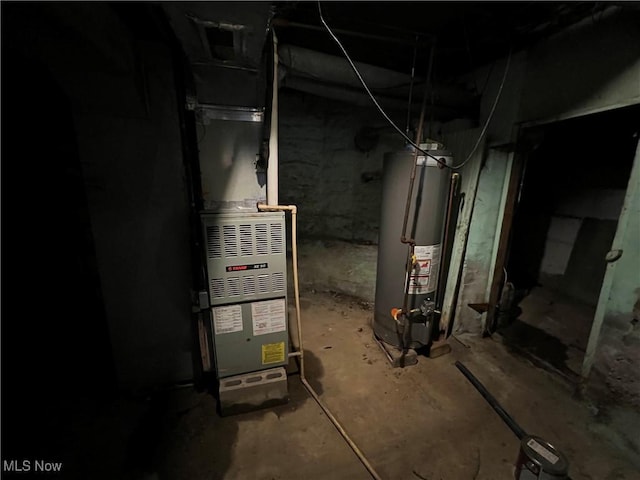 utility room featuring gas water heater